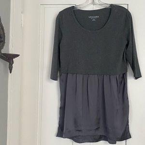 Super cute peplum top loose unique two materials in a beautiful gray.
